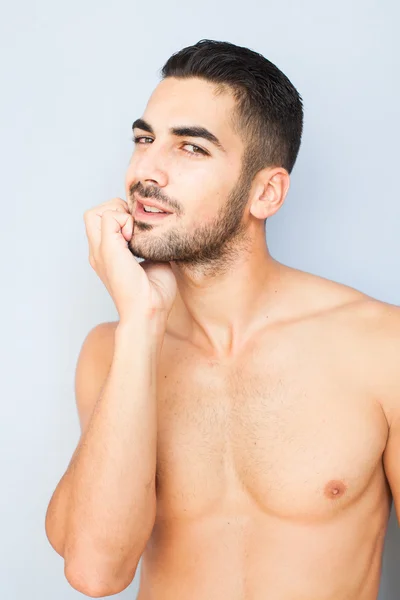 Handsome man touching his beard — Stock Photo, Image