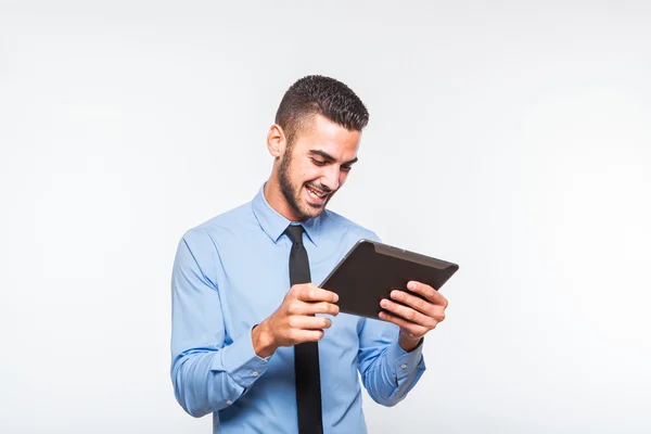 Elegante hombre guapo usando una tableta —  Fotos de Stock