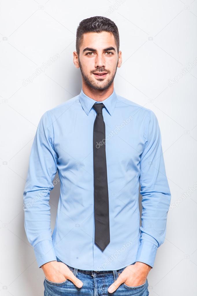 single elegant man in blue shirt with black tie