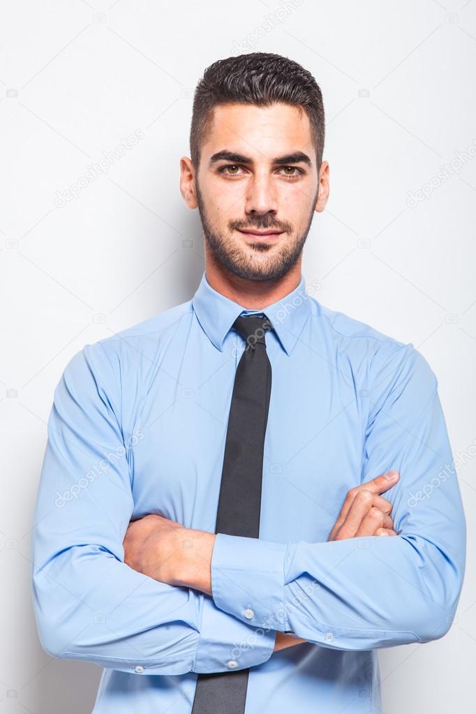 single elegant man in blue shirt with black tie