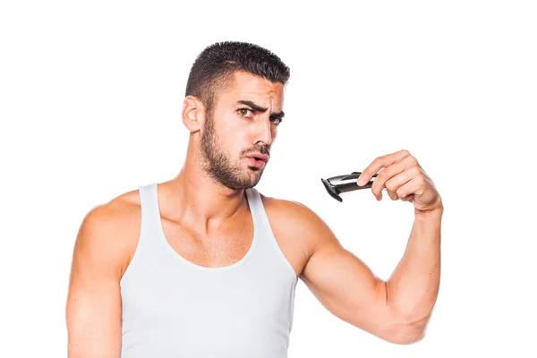 Young handsome man trimming his beard — Stock Photo, Image