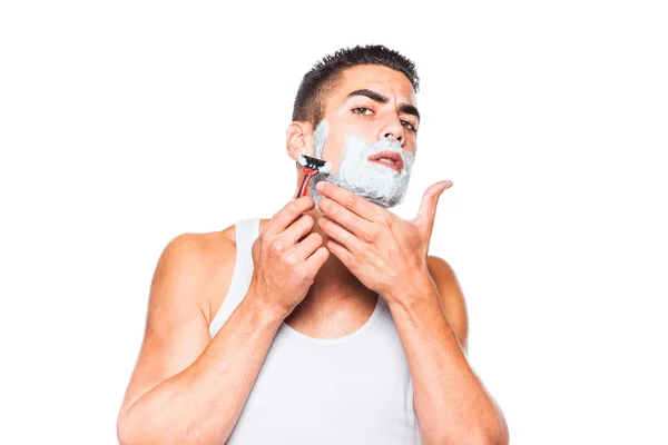 Handsome man shaving his beard — Stock Photo, Image