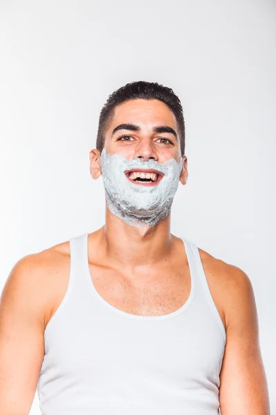 Homem bonito com creme de barbear — Fotografia de Stock