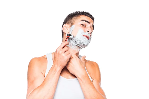 Handsome man shaving his beard — Stock Photo, Image