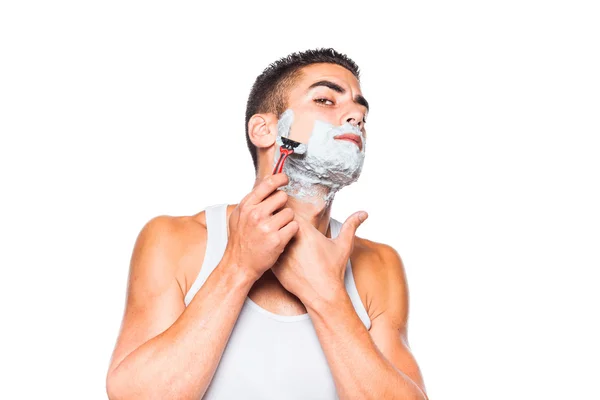 Handsome man shaving his beard — Stock Photo, Image