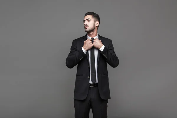 Handsome elegant man on grey background — Stock Photo, Image