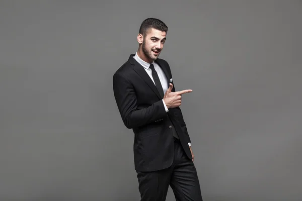 Handsome elegant man on grey background — Stock Photo, Image