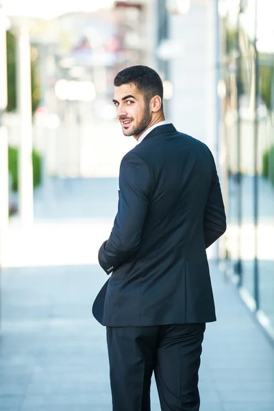 Elegant businessman walking outside — Stock Photo, Image