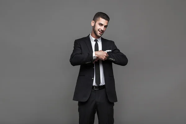 Handsome elegant man on grey background Stock Picture