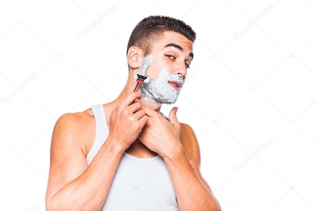 handsome man shaving his beard