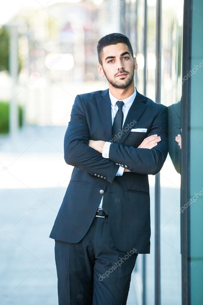 elegant businessman standing outside