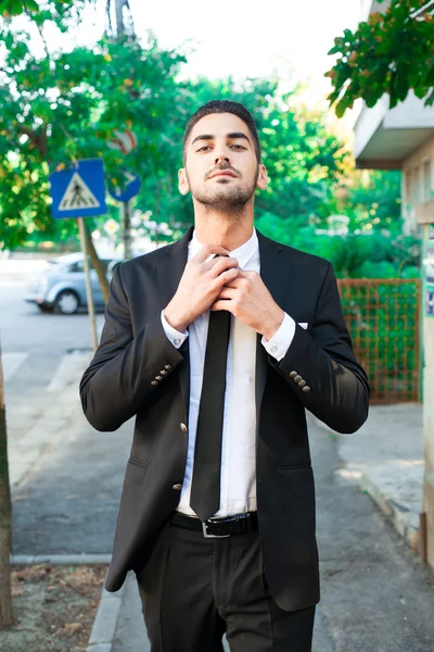 Elegant businessman walking outside — Stock Photo, Image