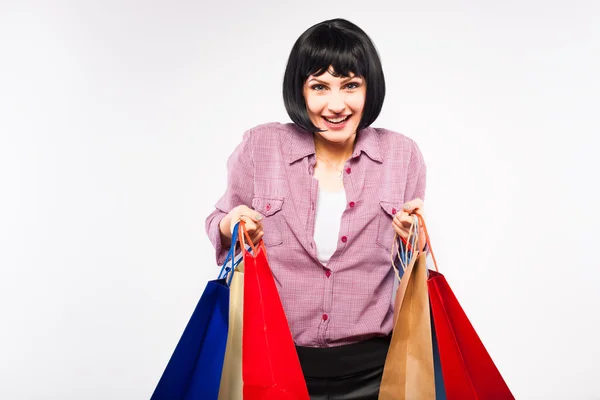 Jovem morena com sacos de compras — Fotografia de Stock