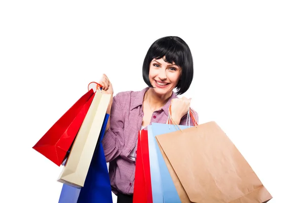 Jeune femme brune avec des sacs à provisions — Photo