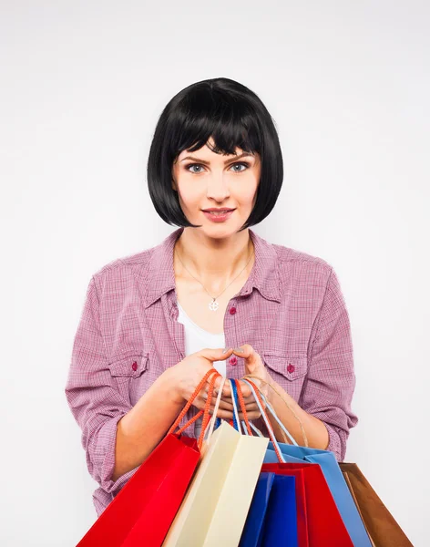 Jovem morena com sacos de compras — Fotografia de Stock