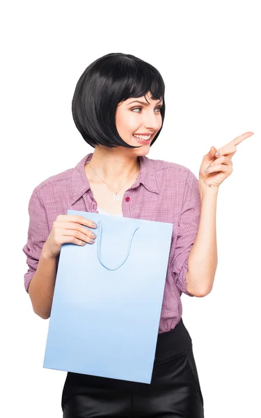 Young brunette woman with shopping bag — Stock Photo, Image