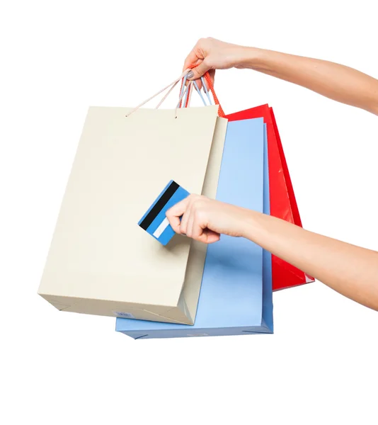 Holding eller alışveriş torbaları beyaz arka plan üzerinde renkli — Stok fotoğraf
