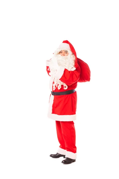 Papai Noel segurando seu saco de presentes no fundo branco — Fotografia de Stock