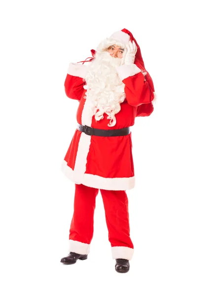 Papai Noel segurando seu saco de presentes no fundo branco — Fotografia de Stock