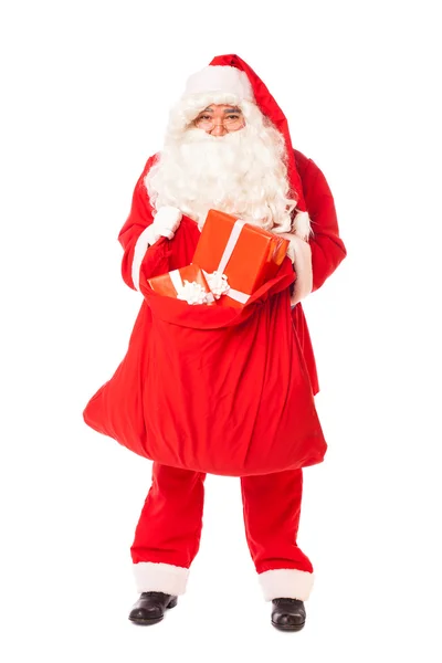Santa claus holding his sack of gifts on white background — Stock Photo, Image