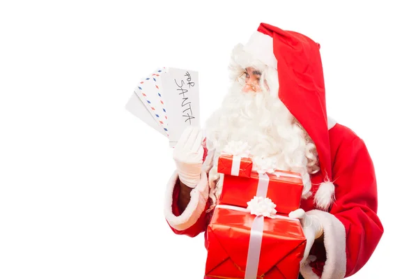 Santa claus with gifts and letters isolated on white, with copy — Stock Photo, Image