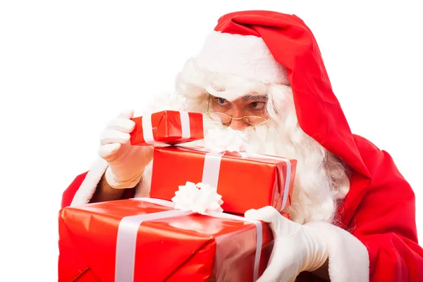 Santa claus with gifts isolated on white, with copy space Royalty Free Stock Photos