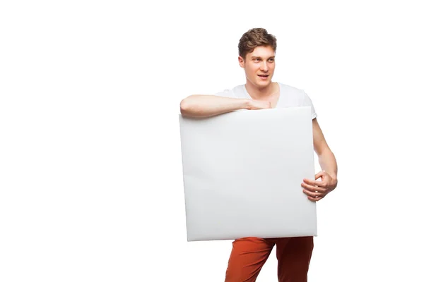 Jovem loira homem mostrando vazio painel isolado no branco — Fotografia de Stock
