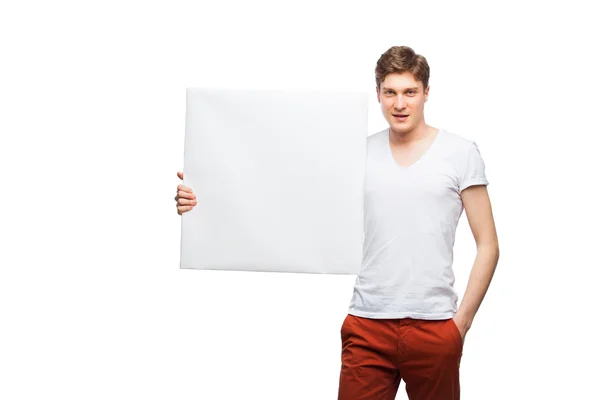 Giovane uomo biondo mostrando pannello vuoto isolato su bianco — Foto Stock