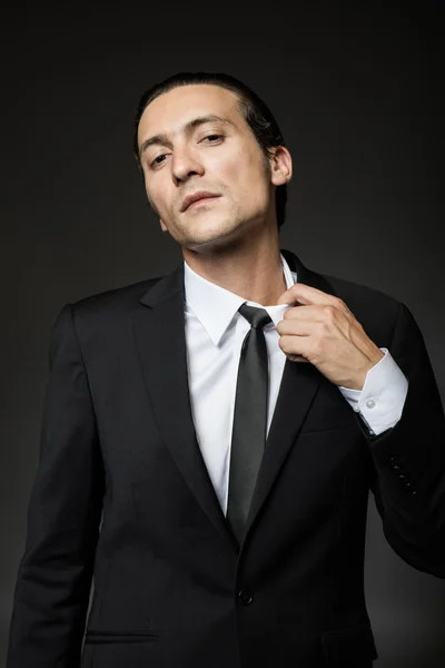 Attractive man in black suit — Stock Photo, Image