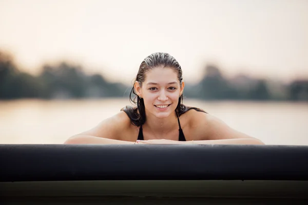 Wet woman in water on paddleboard — Stock Photo, Image
