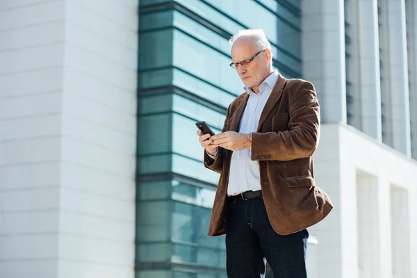 Adult person with gray hair elegant dressed outside — Stock Photo, Image