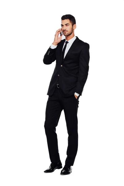 Elegant man in black suit, on white — Stock Photo, Image