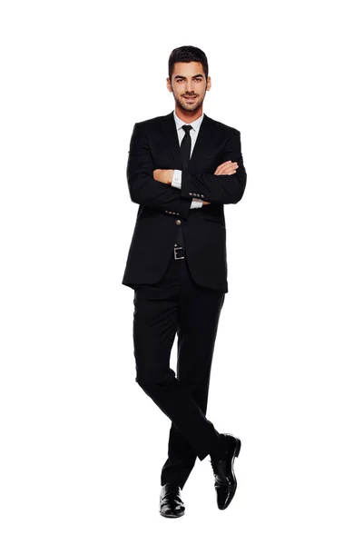 Eleganter Mann im schwarzen Anzug, auf weiß — Stockfoto