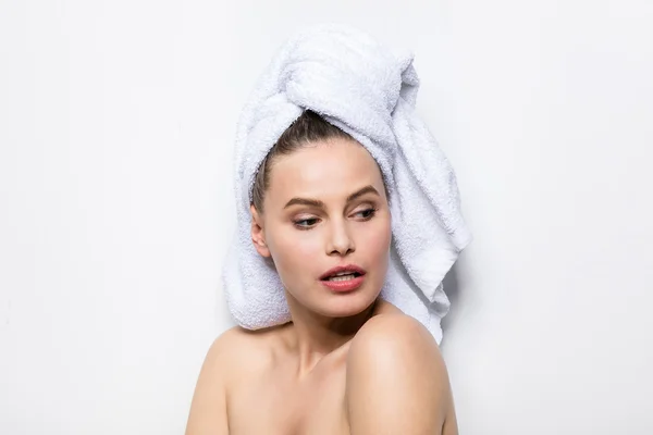 Beautiful young woman with bath towel on head — Stock Photo, Image