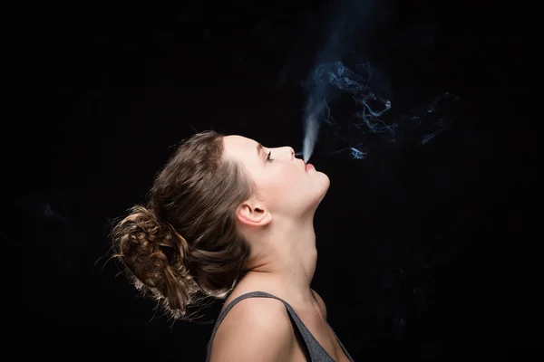 Woman smoking concept on black — Stock Photo, Image
