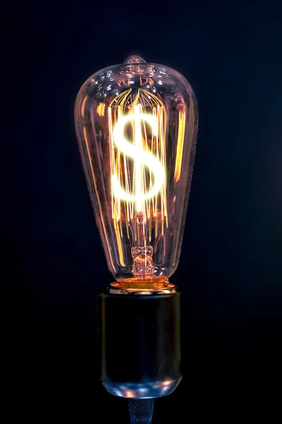 On gagne de l'argent. Ampoule avec symbole Dollar . — Photo
