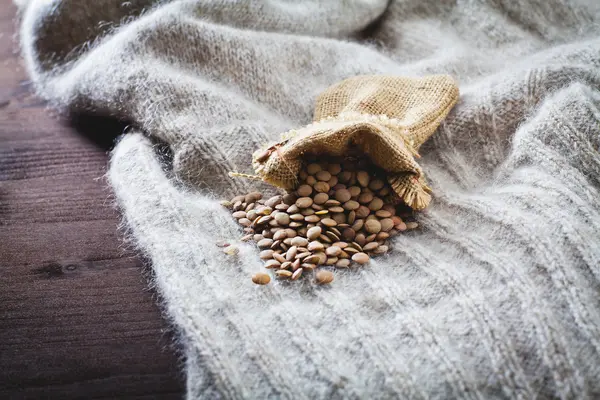 Handful of lentils in the sack — Stock Photo, Image