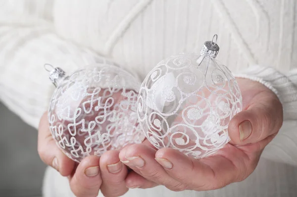 Christmas ball in hand — Stock Photo, Image