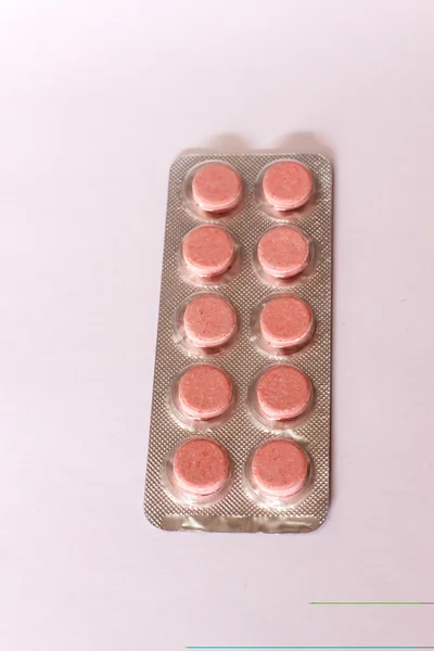 Розовые таблетки — стоковое фото