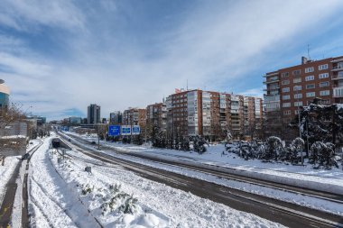 View from a bridge of the A2 highway with snow, a sunny day, Madrid, Spain, Europe, January 10, 2021, horizontal clipart