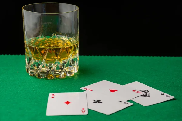 Close Glass Whiskey Green Game Mat Defocused Aces Black Background Stock Image