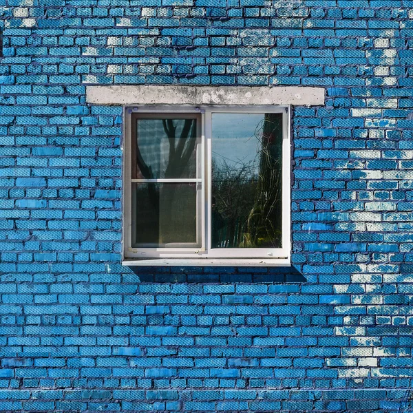 Blue brick wall and window. Brick building. Old brickwork
