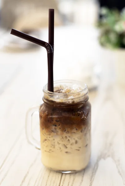 Delicious ice coffee americano on wood table — Stock Photo, Image