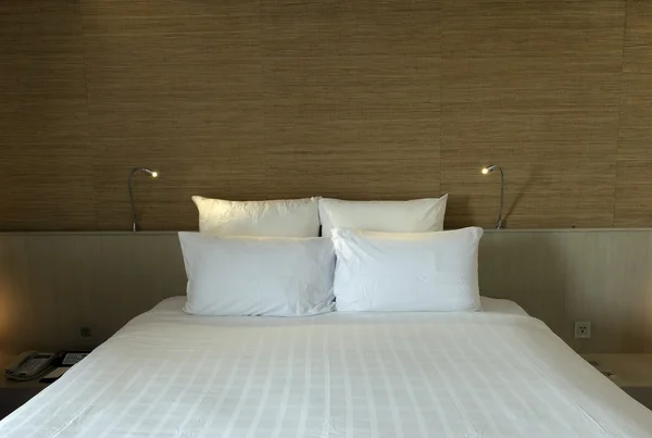 Bed in a business hotel room — Stock Photo, Image