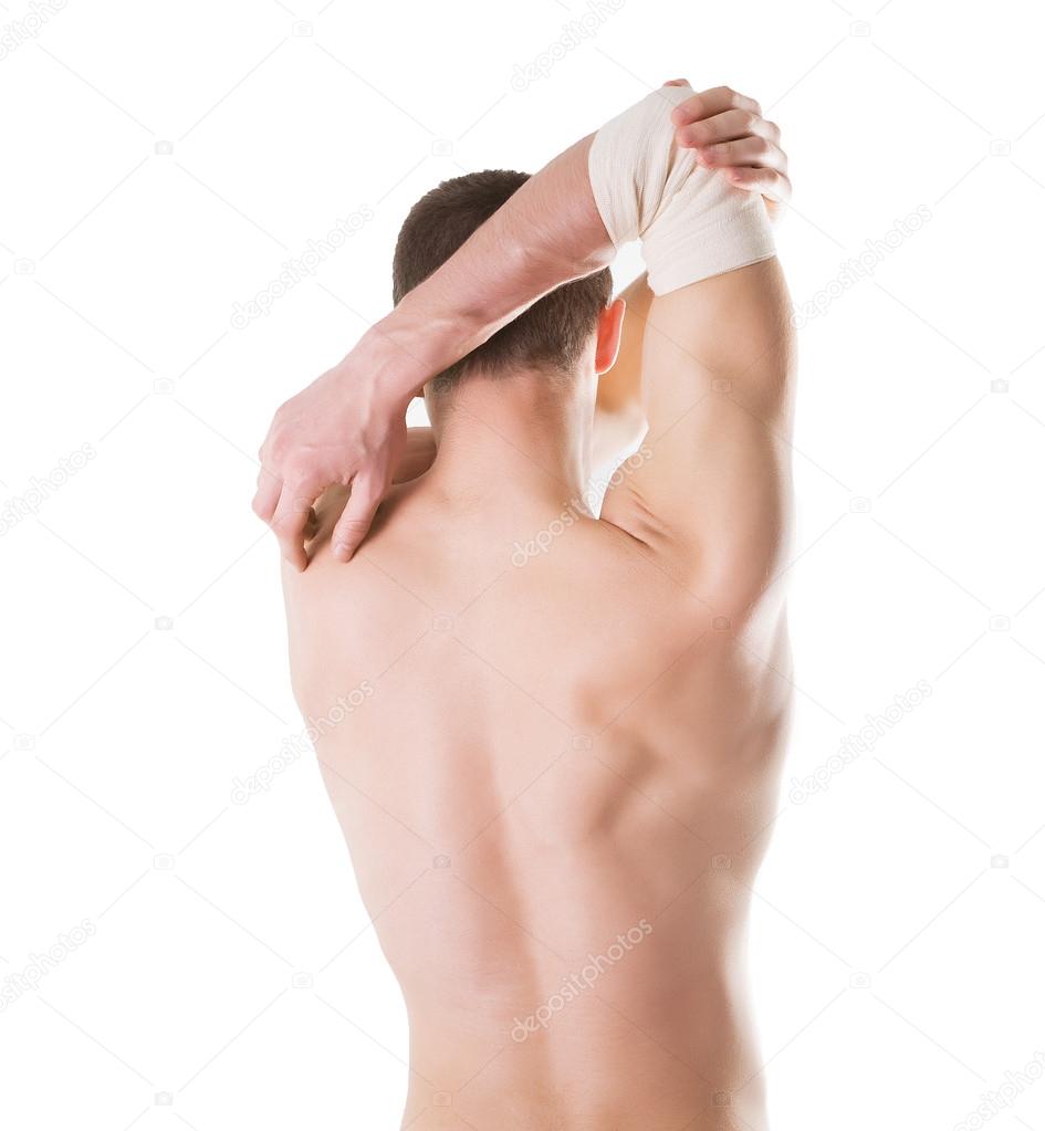 elastic bandage on a hand of the man with ideal skin. Isolated on a white background