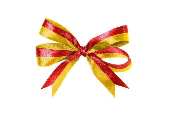 Fita de tecido multicolorido vermelho-amarelo e arco isolado em um fundo branco — Fotografia de Stock