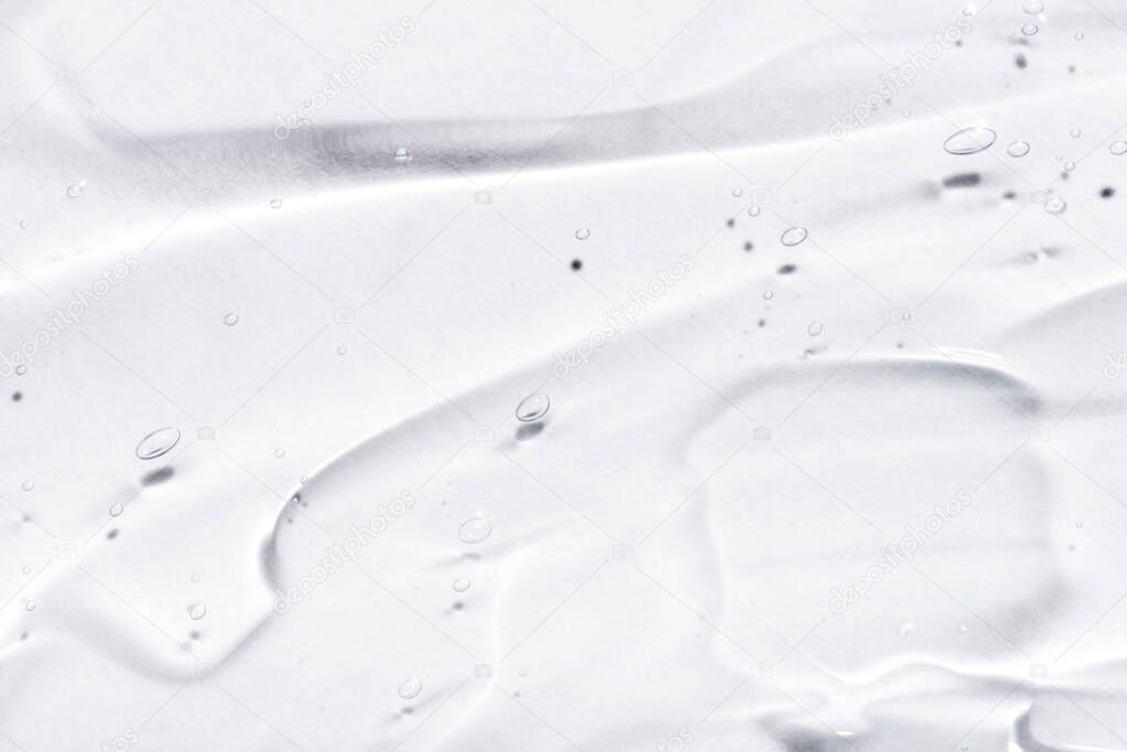 Transparent hyaluronic acid gel on a white background.