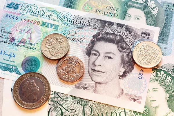 Pound, coins and banknotes — Stock Photo, Image