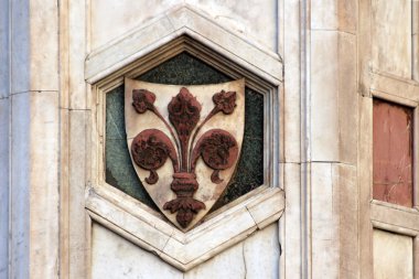 FLORENCE, ITALY - NOVEMBER, 2015: City historical coat of arm, detail of the Giotto bell tower