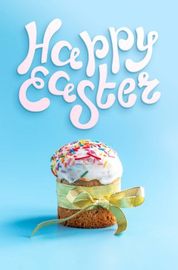 Traditional Easter cakes and Hyacinthus flowers on blue background with copy space for text. Happy Easter. Traditional Kulich, Paska Easter Bread. Postcard flat lay